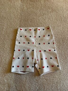 Beach Riot White Biker Shorts with Red & Black Card Suit Motif
